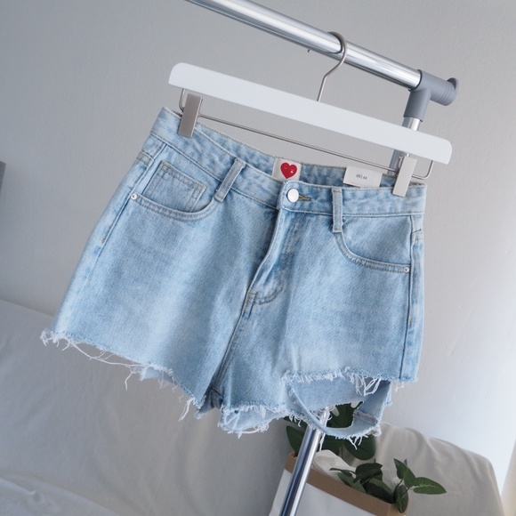 Pants - NWT cut off asymmetrical rip blue denim shorts